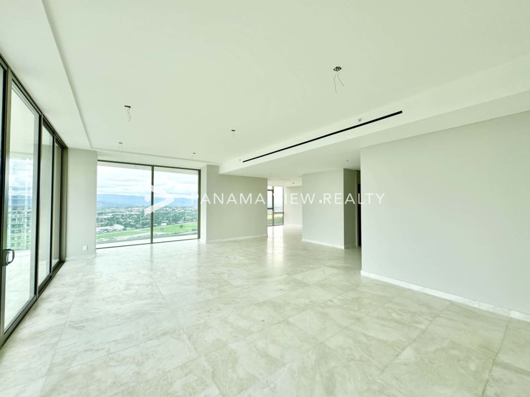Luxury bedroom with floor-to-ceiling windows overlooking golf and city skyline at La Maison by Fendi