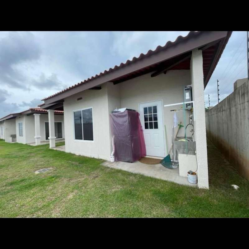 Covered carport with garden in front of house rental Pacora Panama