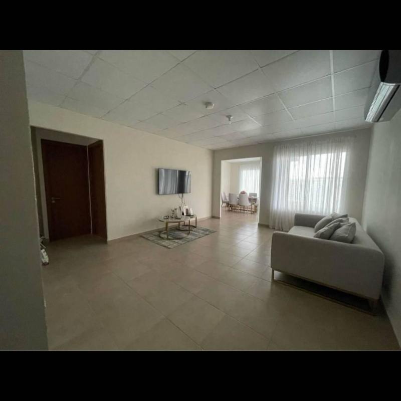 Living room with ceramic tile floor, large window, AC in house for rent Pacora Panama