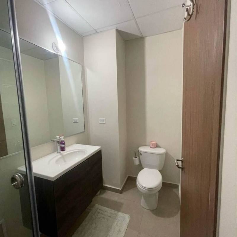 Modern bathroom with walk-in shower, tile walls, vanity, Pacora Panama rental house