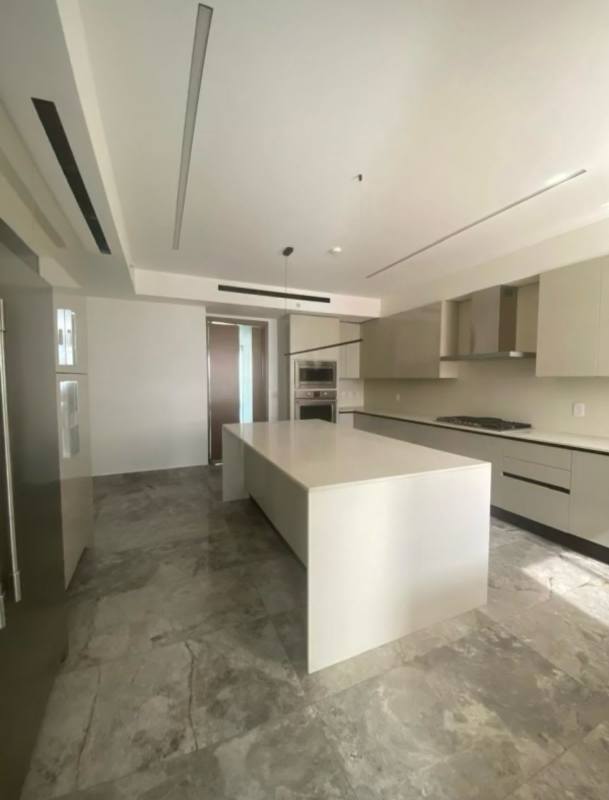 Master bedroom suite with panoramic golf view windows at Empire Residences Santa Maria Panama