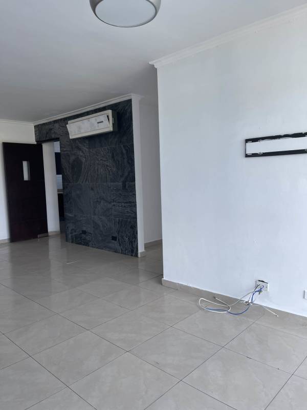 Living area with large sliding door to covered balcony PH Cristal Hill Panama City