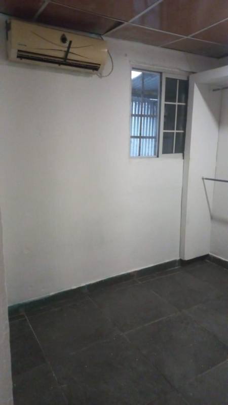 Bedroom with AC unit, secure window grilles in Villalobos Pedregal rental property