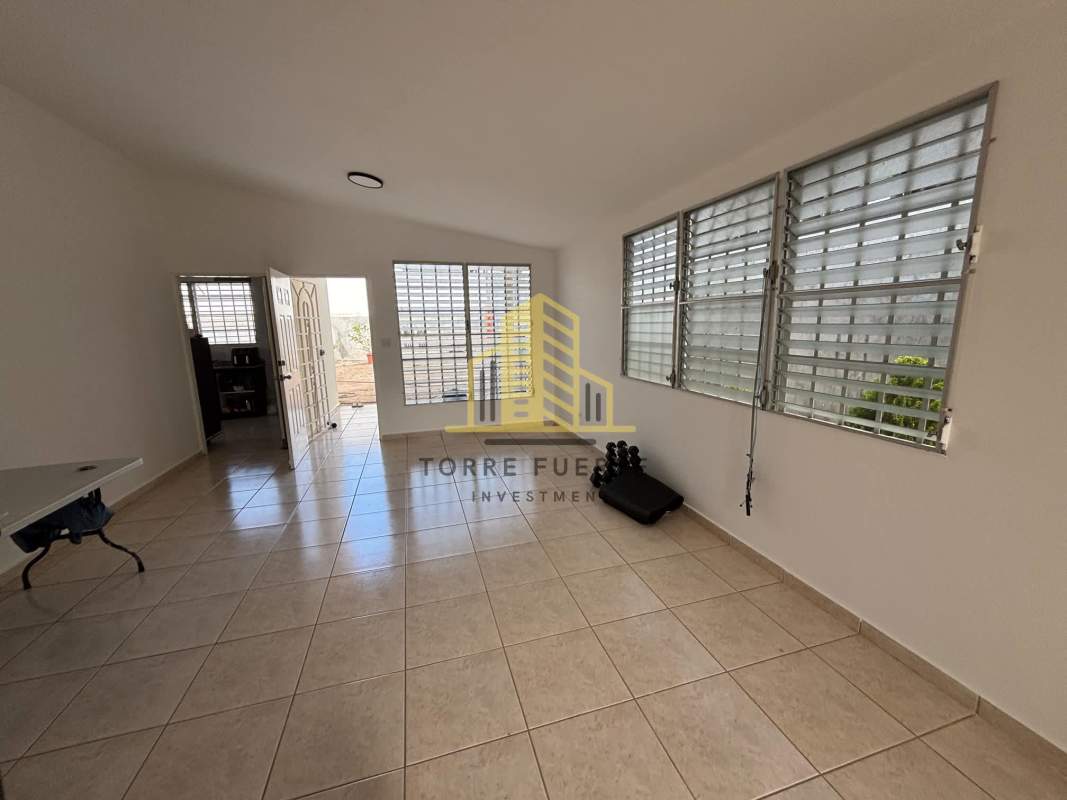 Functional kitchen with granite countertops, tile backsplash, and appliances in Brisas del Golf Panama