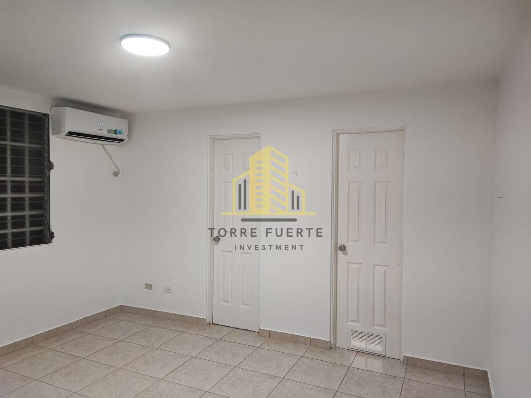 Spacious backyard with brick privacy wall and garden area Brisas del Golf house Panama