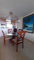 Large balcony with dining set and panoramic Pacific Ocean view in Playa Blanca Resort Panama