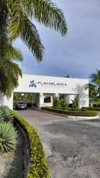 View of lagoon pool, beach and PH Los Balcones building in Playa Blanca Resort Panama