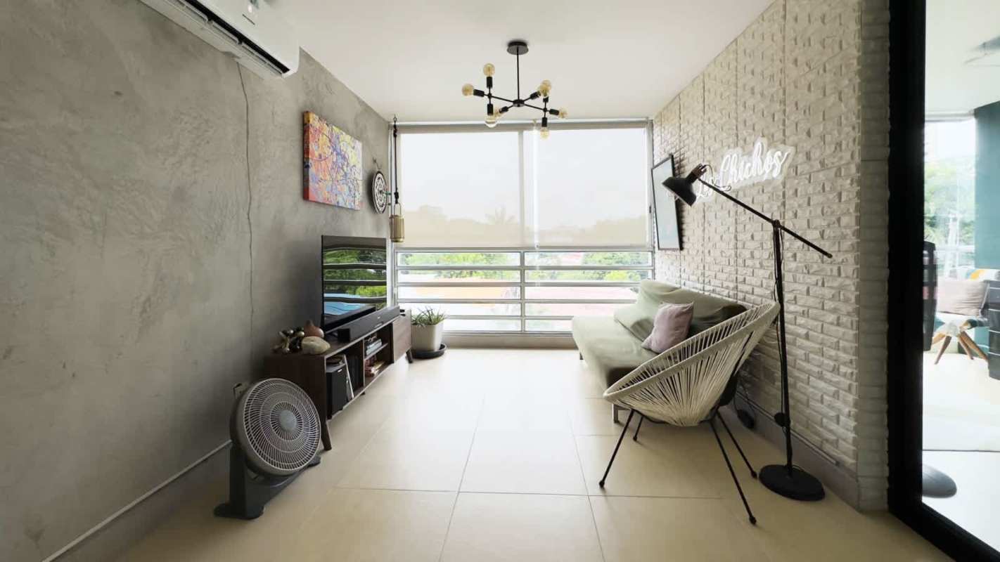 Spacious furnished living room with large windows in PH Villa Cáceres Betania Panama City