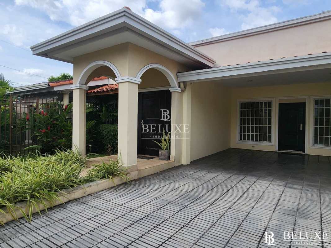 Open plan living dining area with wooden beams and marble floor Altos del Golf Panama