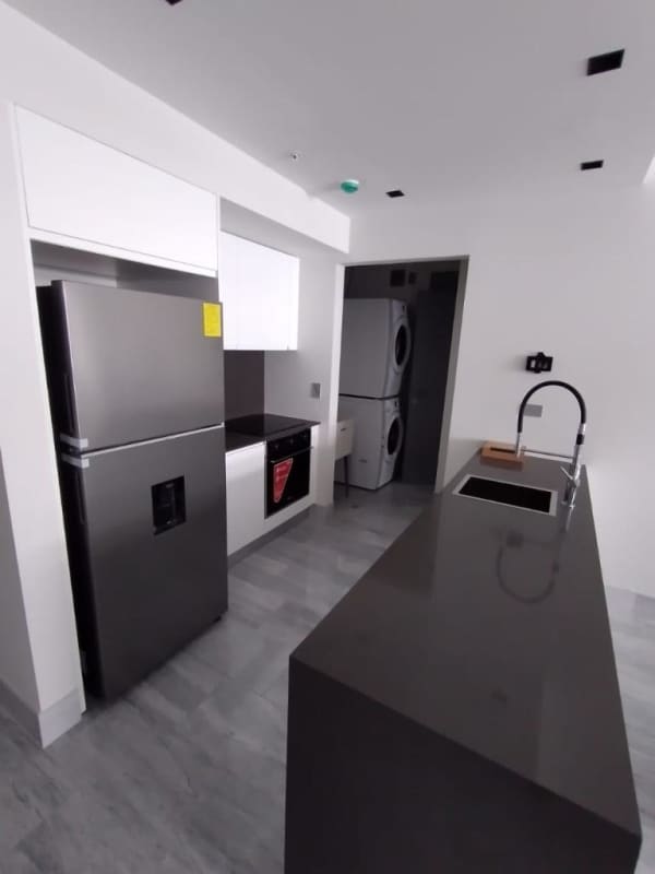 Guest bedroom with ensuite bathroom large window ocean views PH Armani Avenida Balboa Panama