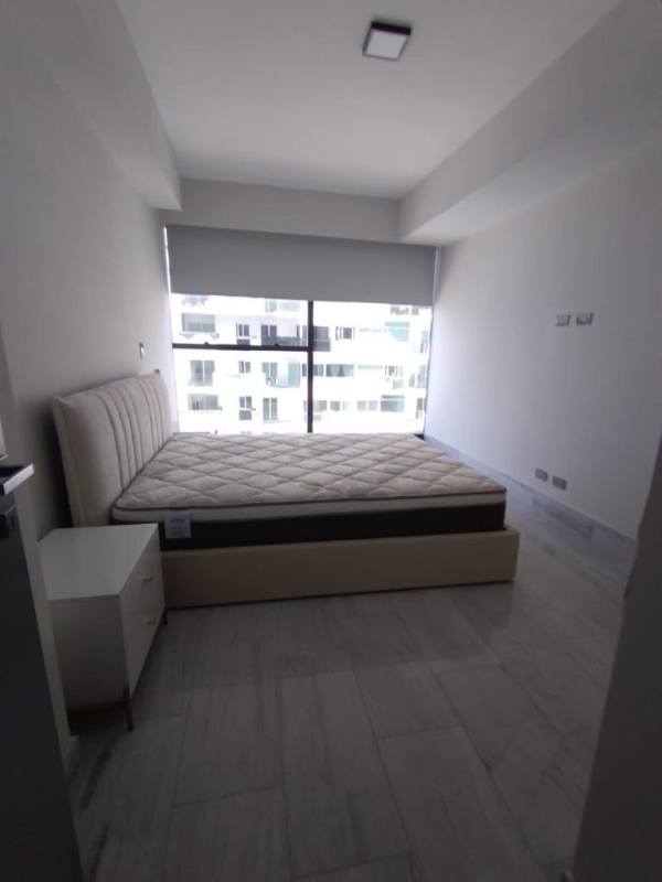 Private balcony with glass railing overlooking Pacific Ocean and Panama skyline in PH Armani Tower