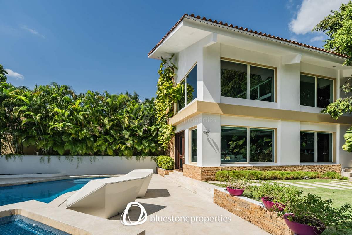 Luxury tropical villa facade with large windows and a private pool in Altos del Golf Panama City