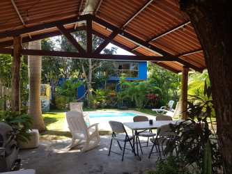 Covered terrace with hammocks, tropical garden vacation house Coronado Panama