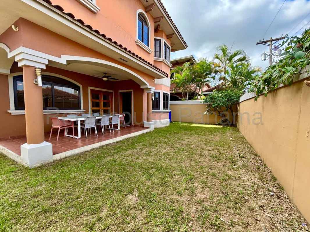 Marble tile bathroom with vanity and glass shower at El Doral Costa Sur rental