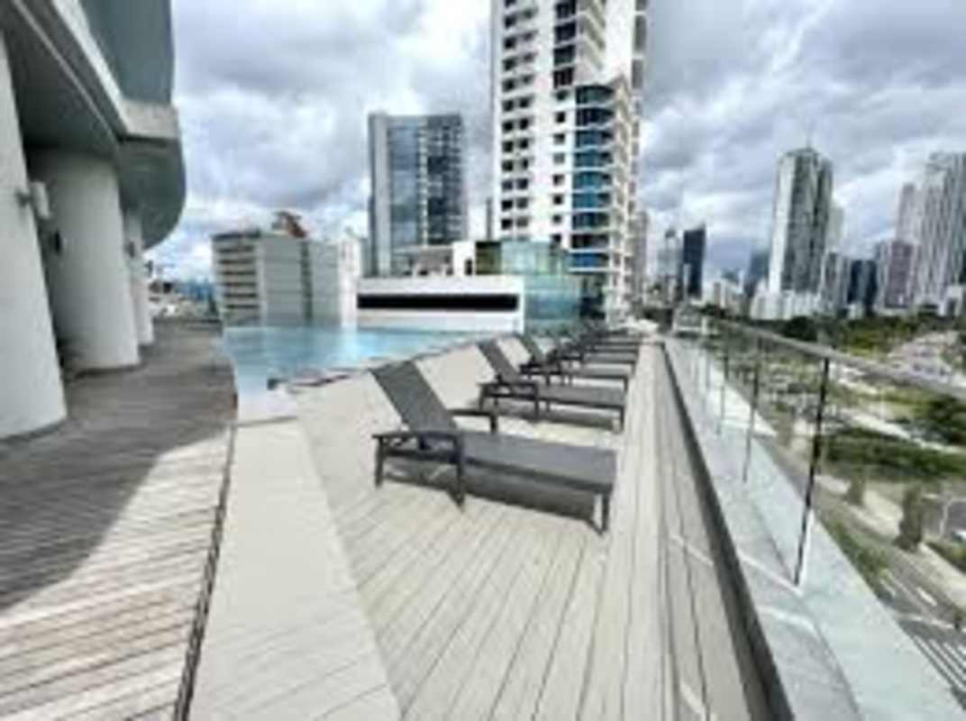 Luxury rooftop pool overlooking Pacific Ocean at Yacht Club Tower Avenida Balboa Panama City