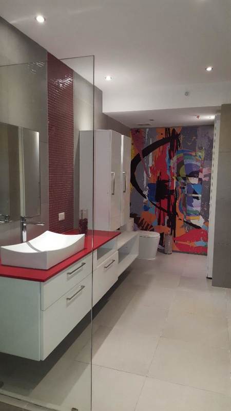 Modern tiled bathroom with vessel sink and glass-enclosed shower Yacht Club Tower Panama
