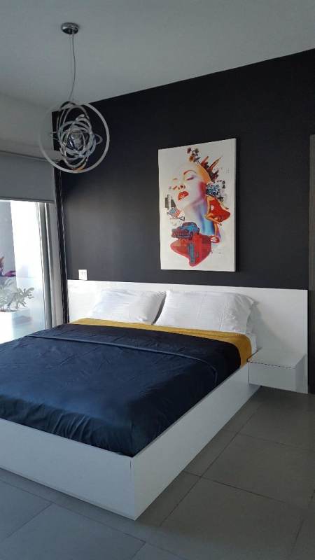 Bedroom with floor to ceiling windows panoramic views Yacht Club Tower Panama City