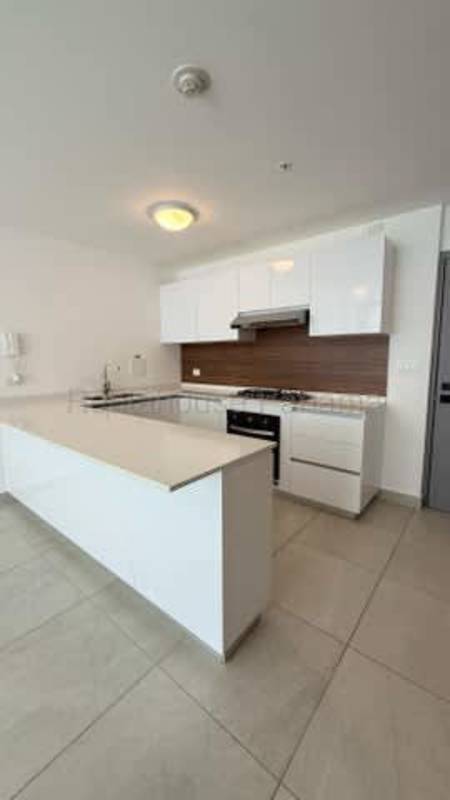 White cabinetry modern kitchen with fridge space Bella Vista PH Van Gogh Panama