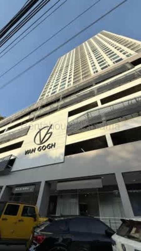 Bright modern kitchen with white tiles and cabinets and large frosted window in rental apartment Bella Vista Panama