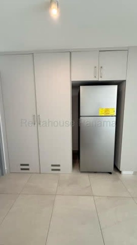 Minimalist kitchen design with recessed appliance space and bright tiles in PH Van Gogh Panama