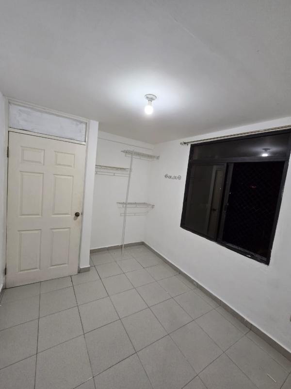 Multi-story apartment building facade with balconies and grid windows in Rio Abajo Panama