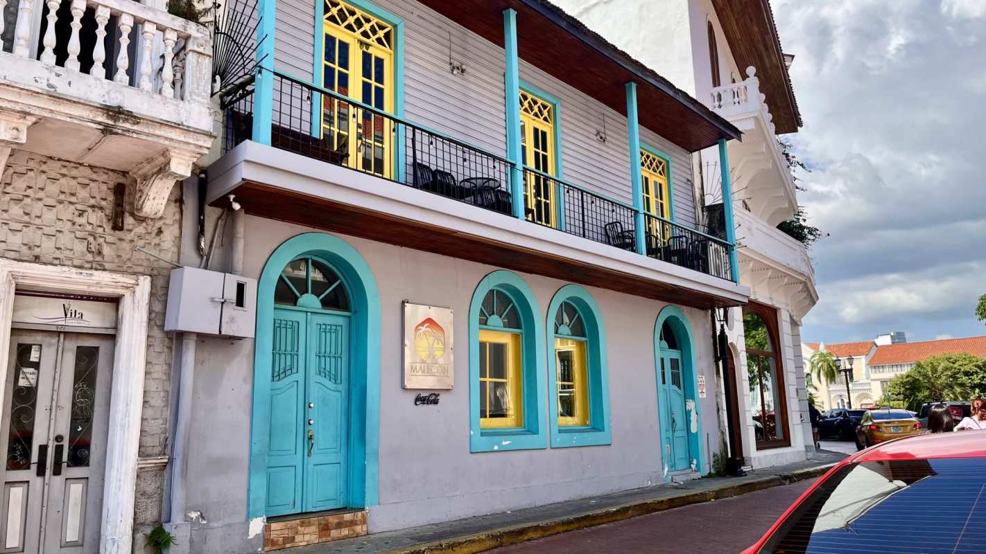 Open commercial interior with decorative ceiling greenery and bar counter in Casco Viejo Panama City