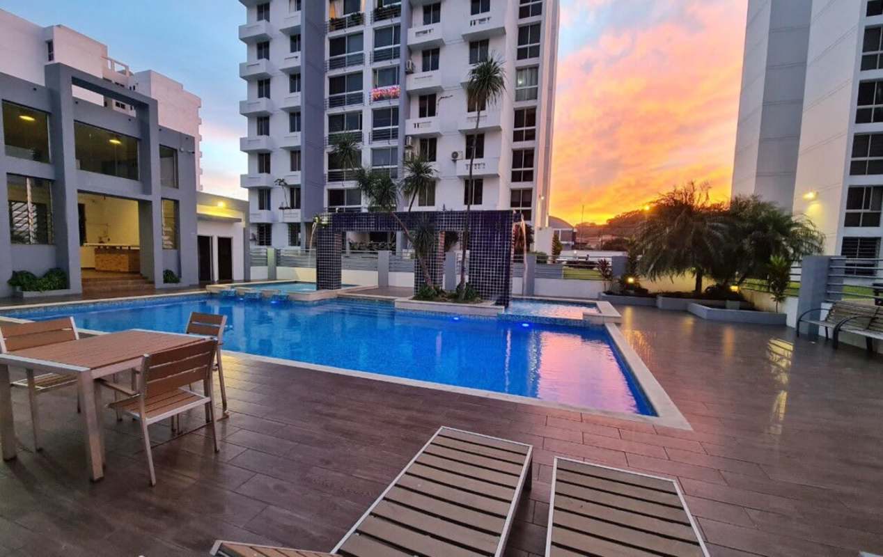 Modern living area with stone accent wall Condado Gardens Condado del Rey Panama