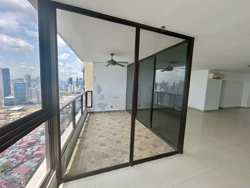 Balcony with glass railing overlooking Panama City skyline and Pacific Ocean at PH San Francisco Bay