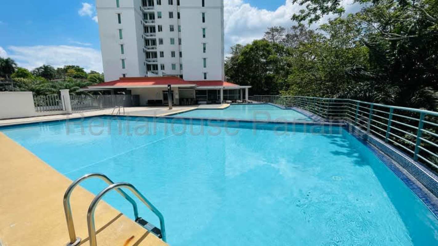 Spacious bedroom with large windows and balcony access at Clayton Park Panama