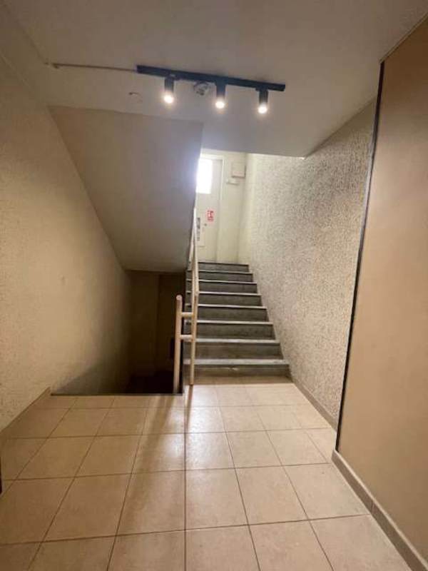 Building stairwell with tile floors, concrete steps and emergency exit at PH Mystic Tower Panama