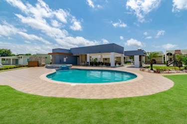 Front facade modern single-story townhouse double covered parking minimalist design in Costa Verde