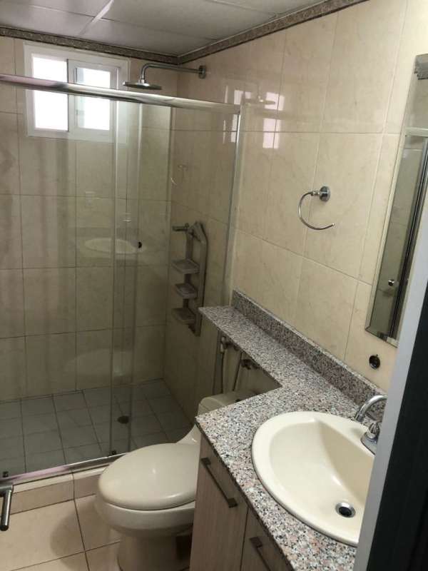 Bathroom with granite countertop, enclosed shower at PH La Sabana Panama City rental