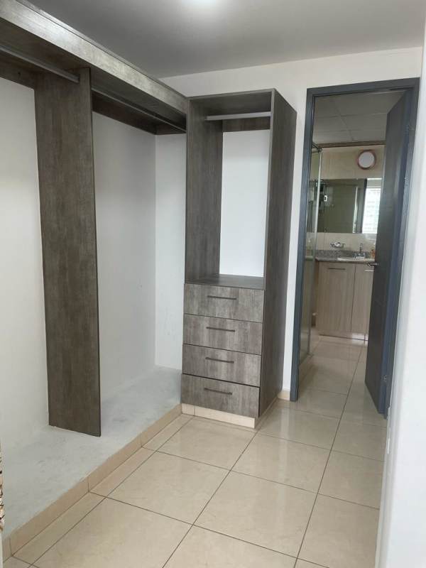 Walk-in wardrobe with built-in cabinets, access bathroom PH La Sabana Panama