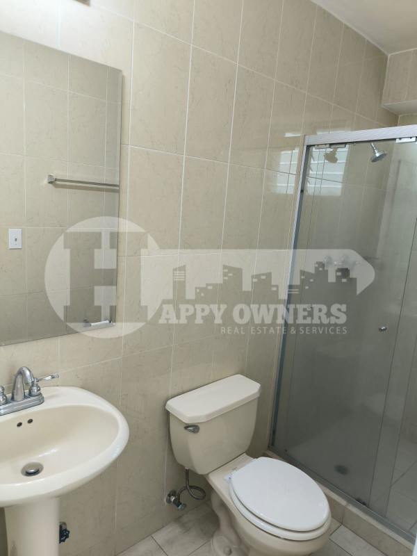 Bedroom with large windows, tiled floors and city skyline view in PH Majestic Garden Edison Park Panama City