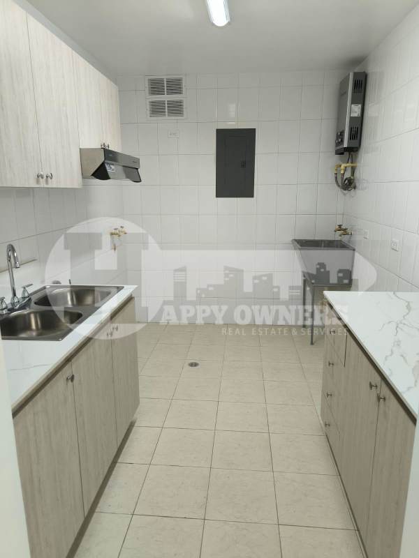 Dining area adjacent to kitchen and living room with ceramic tile floors PH Majestic Garden Edison Park Panama City