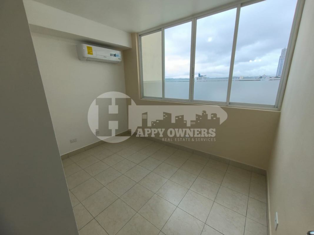 Spacious bedroom with tiled floors, closet space and large window PH Majestic Garden Edison Park Panama City