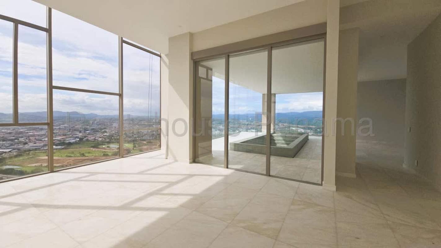 Open concept luxury living space with floor-to-ceiling windows and marble flooring in Santa Maria Penthouse Panama
