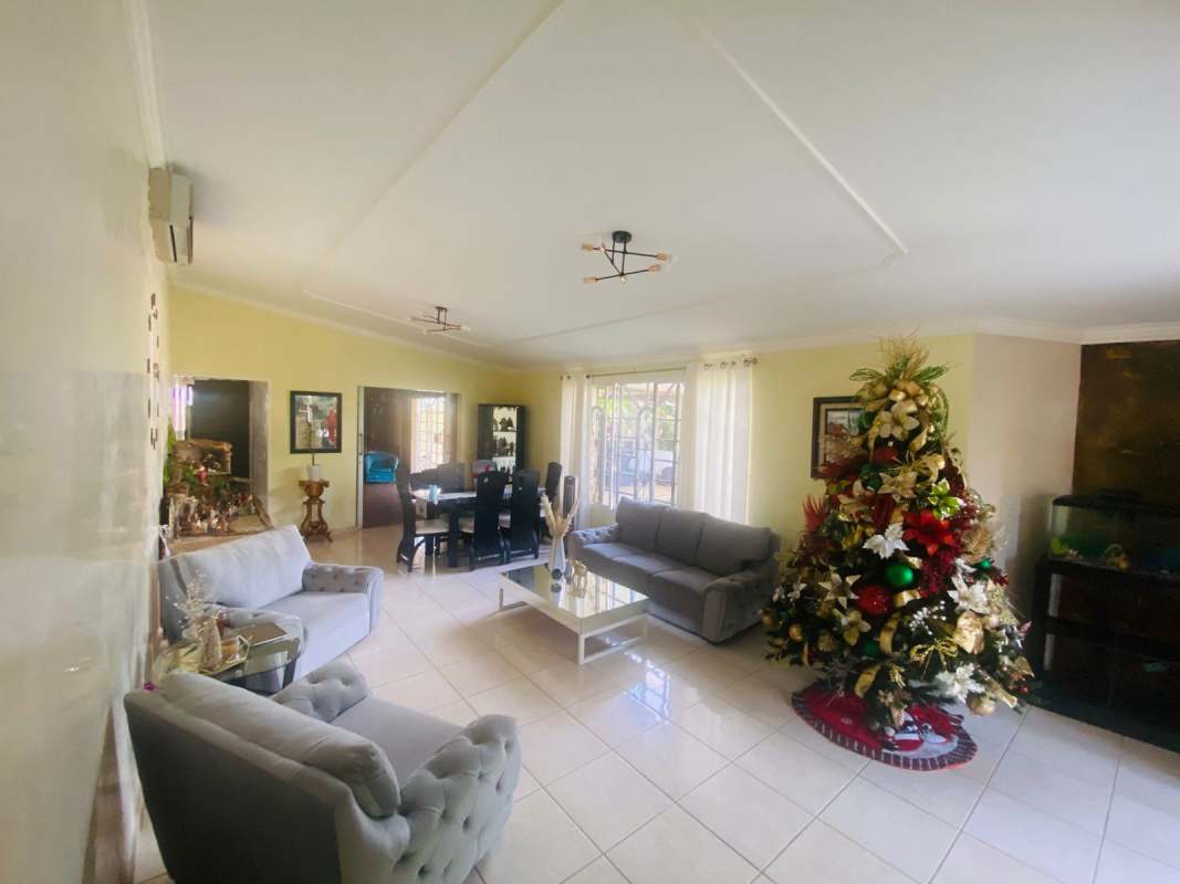 Contemporary kitchen with granite countertops, island, and black cabinets
