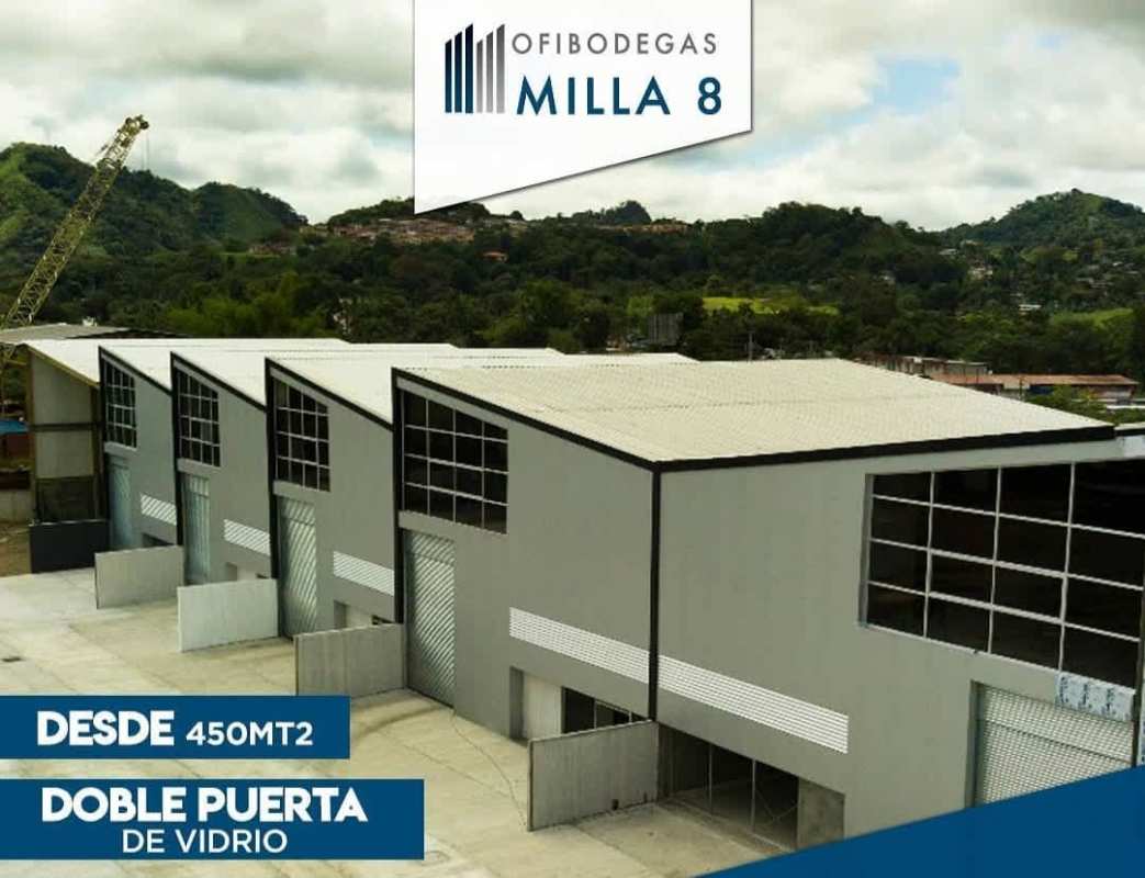 Aerial photograph of industrial warehouses with mountain backdrop and truck bays Milla 8 Panama