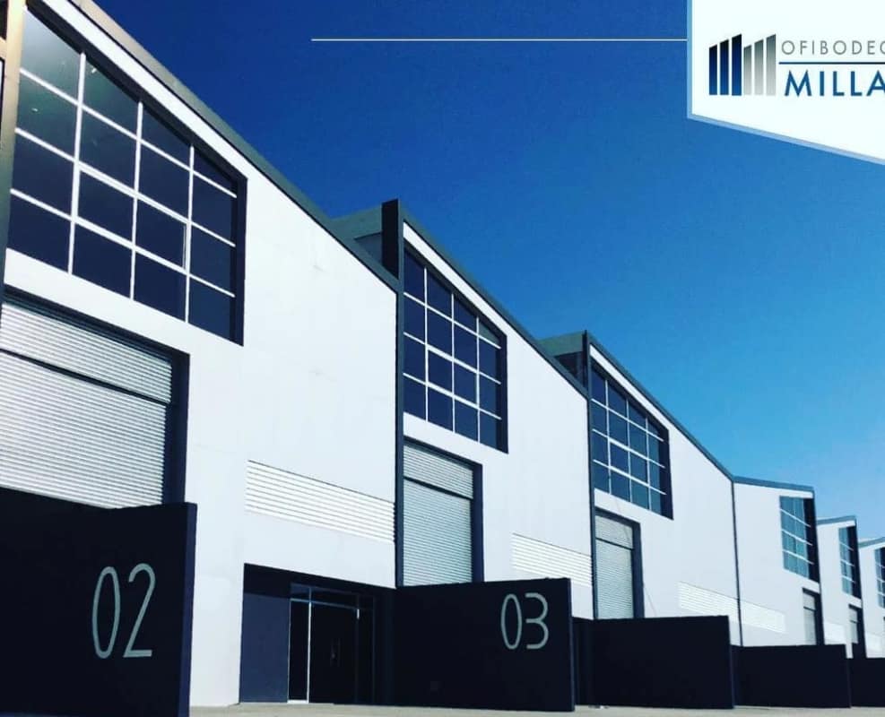 Modern facade with large roll-up industrial doors and glass panels in Milla 8 warehouse complex