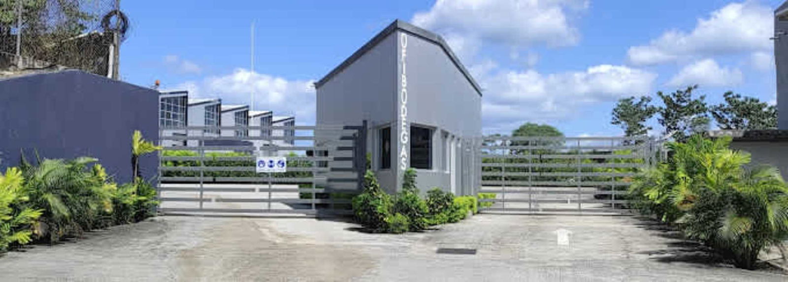 Gated entrance industrial warehouse complex Ofibodegas Milla 8 Panama with modern design