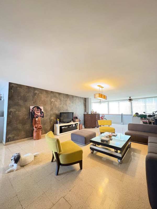 Contemporary living room with sectional sofa, large windows, natural light El Cangrejo PH Vista Hermosa Panama City