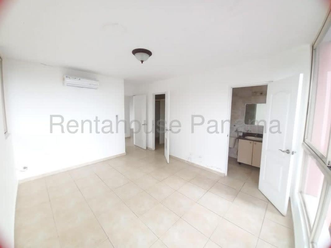 Bedroom with large corner windows and tile flooring at PH San Francisco Bay Panama