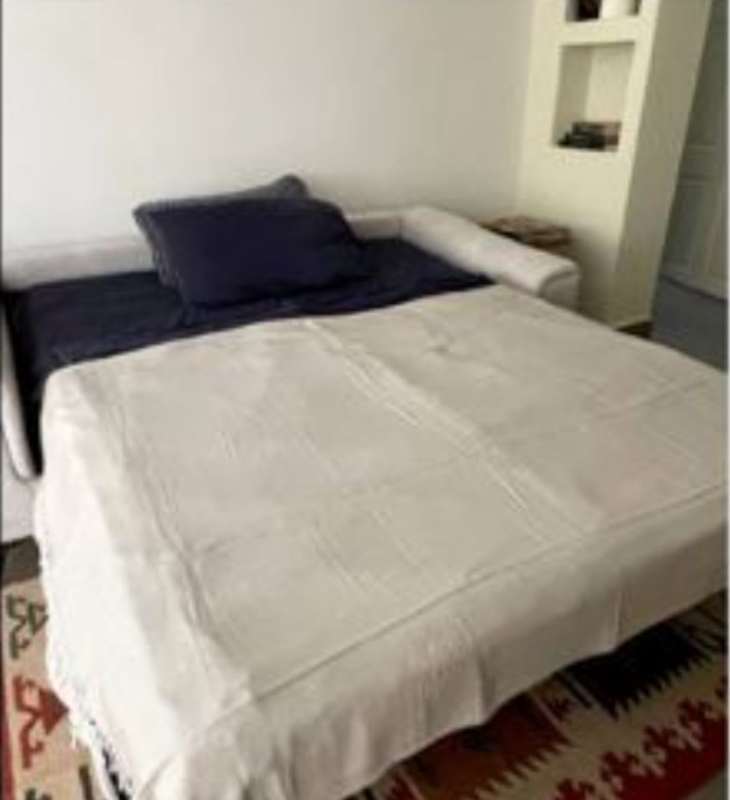 Compact kitchen with wood cabinets, appliances, breakfast counter PH Albrook Residences Panama City