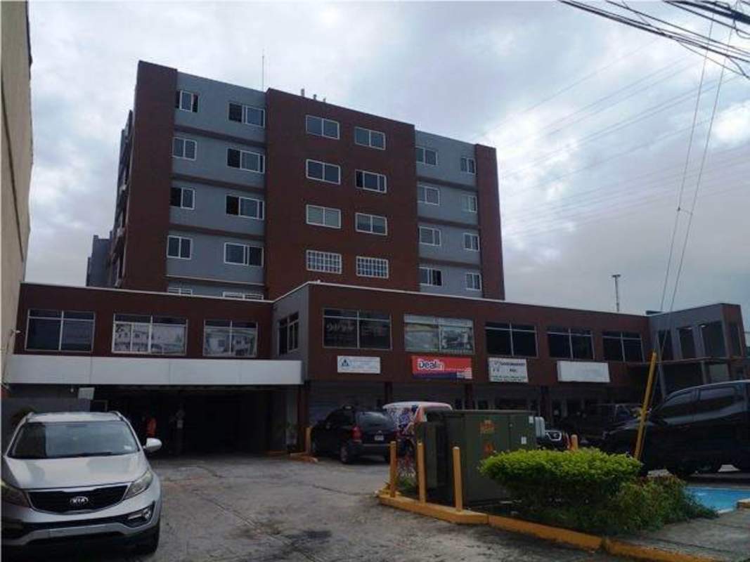 Compact kitchen with granite counters and modern cabinetry PH Madison Towers Altos de Panamá