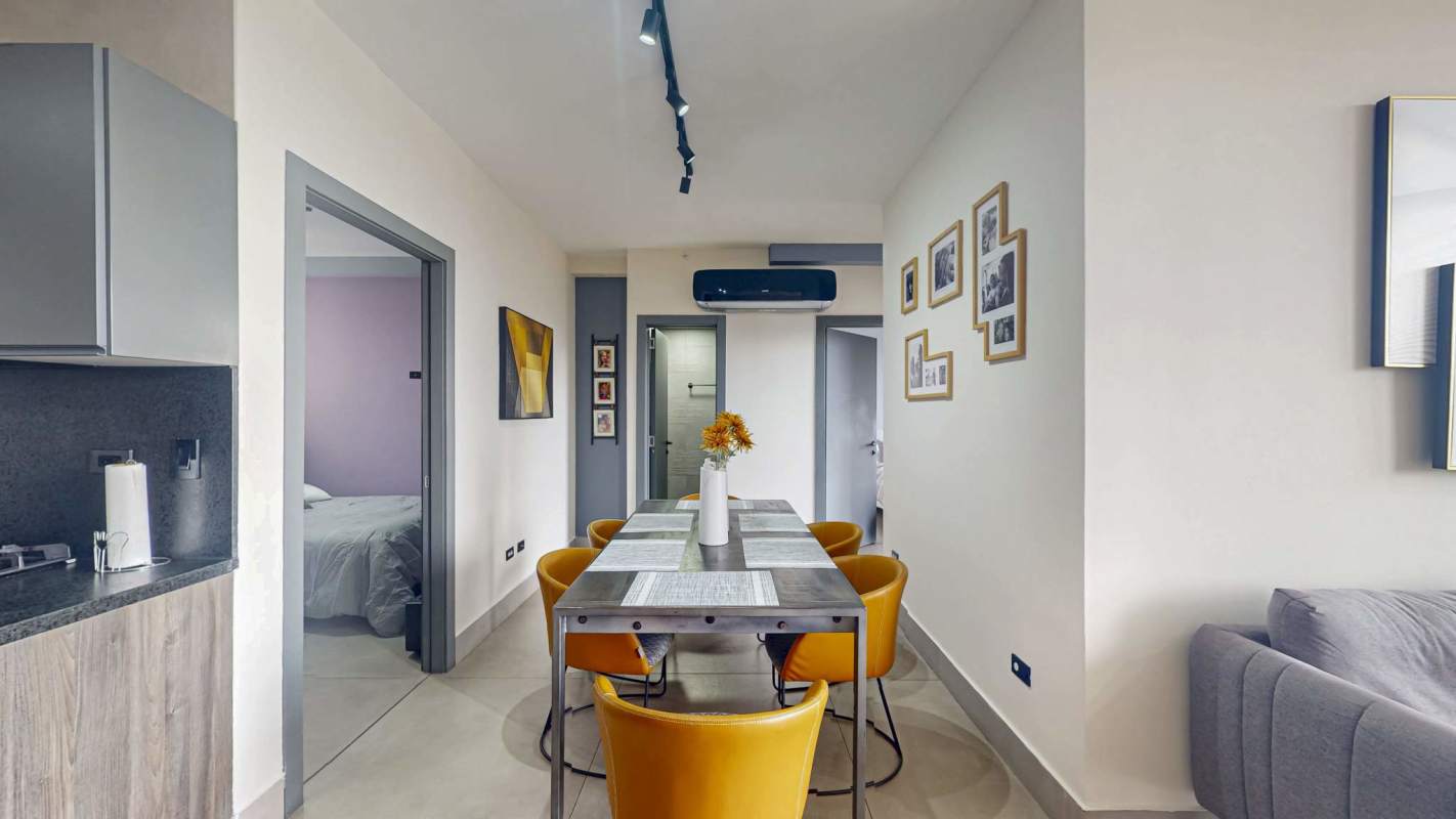 Contemporary open kitchen with appliances and granite counters at PH Victory Sport Panama