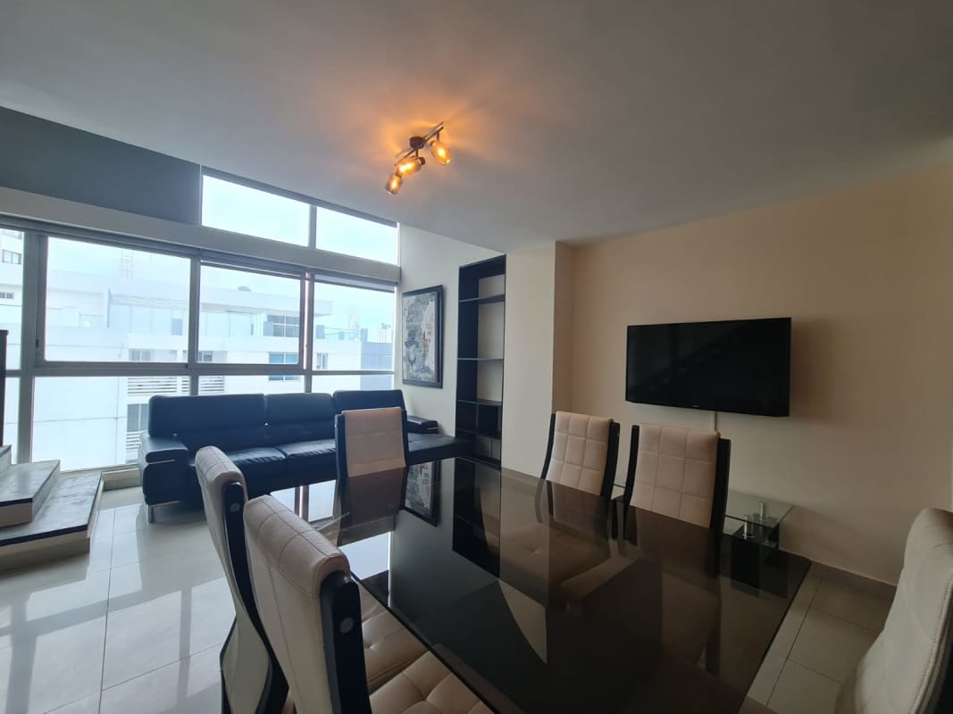 Open loft dining area with glass table, city views in PH Vitro Loft El Cangrejo Panama City