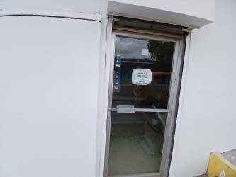 Empty commercial interior with partitions for office and tiled floor in La Chorrera