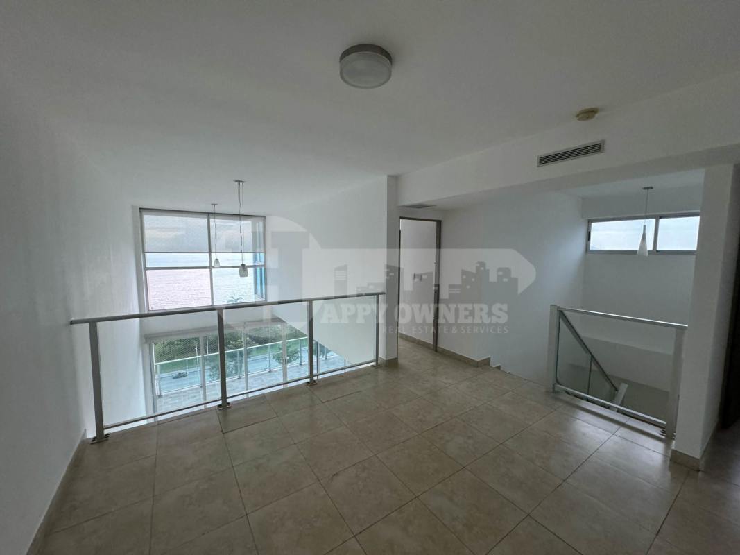Contemporary kitchen with granite countertops in duplex apartment PH H2O On the Ocean Panama