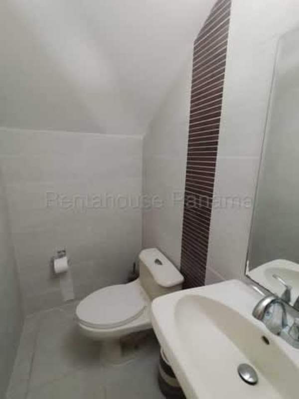 Bright staircase with tiles and metal railings in home for sale at Brisas del Golf Panama